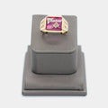 Pre-owned 10K yellow gold Freemason ring, size 9.5, featuring a large rectangular red stone with the Masonic square and compass emblem and a small white stone accent, shown front-facing on a display stand. Weighs 6.78 grams.
