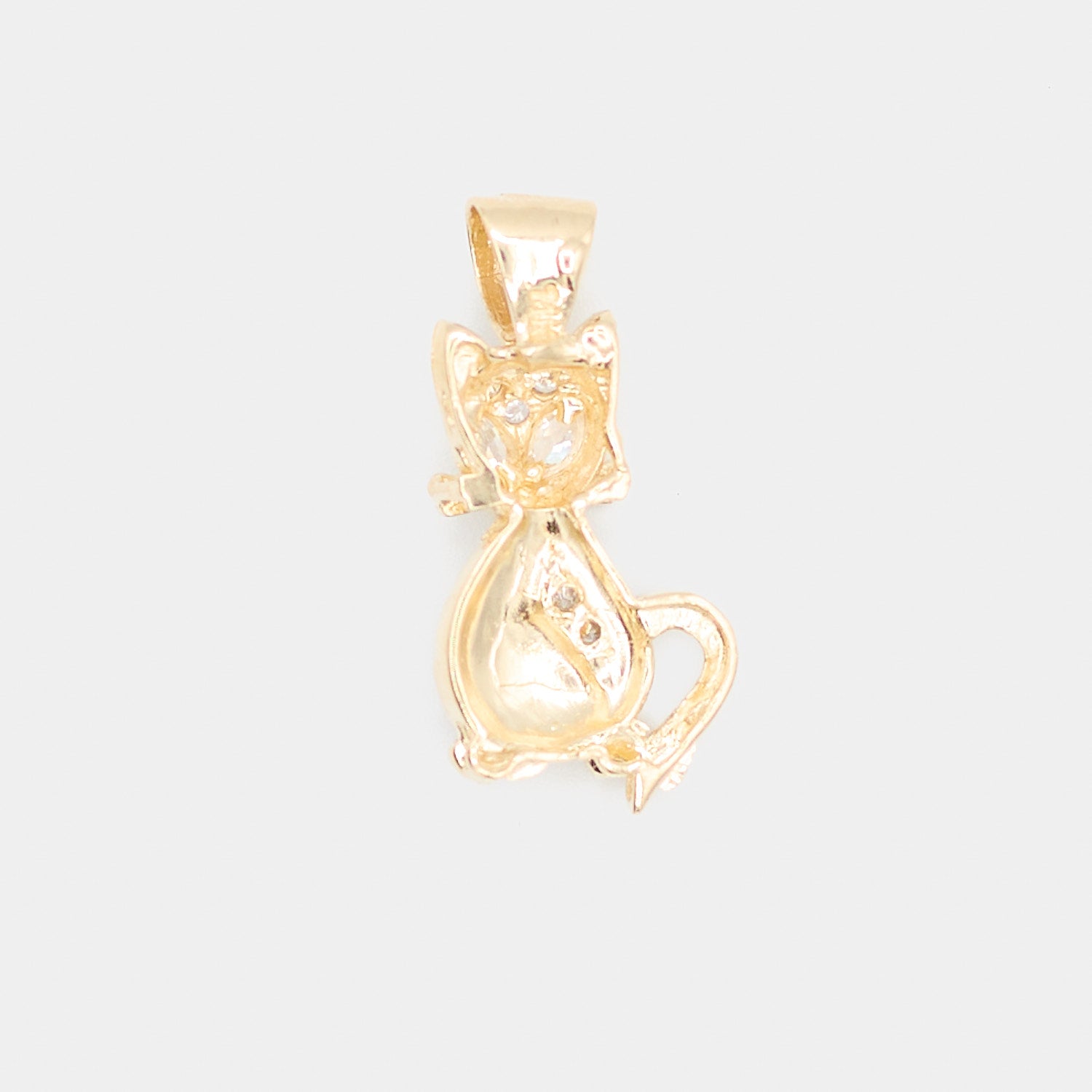 Back view of a pre-owned 14K yellow gold cat charm showing the smooth reverse side and bail detail, weighing 3.2 grams.