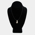 Pre-owned 14K yellow gold cat charm with white stone accents, shown on a black cord necklace against a display bust. Charm measures 1 1/8 inch.