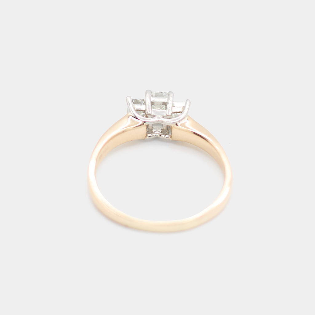 Back view of a pre-owned 14K yellow gold engagement ring showing the prong settings from behind, weighing 4.32 grams.