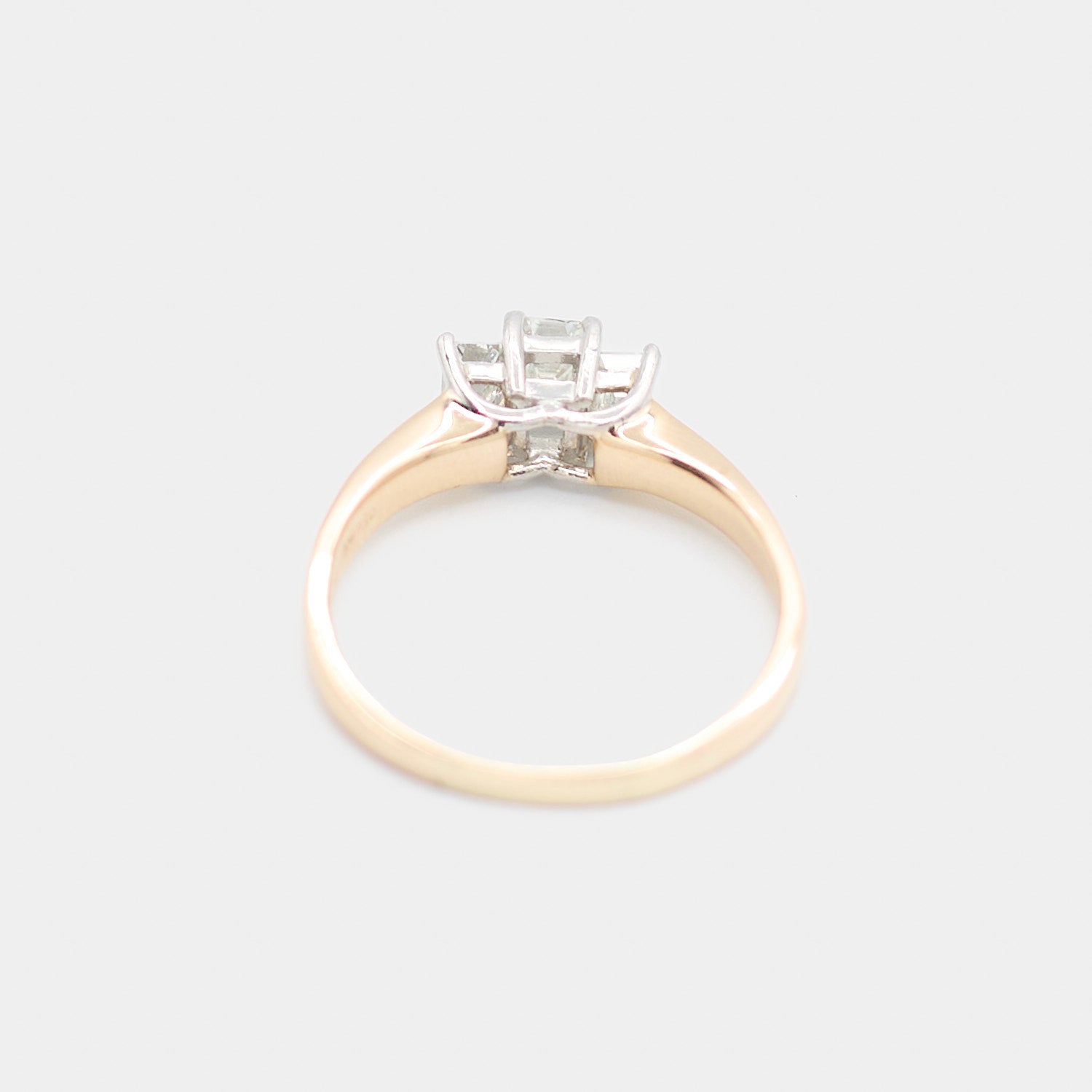 Back view of a pre-owned 14K yellow gold engagement ring showing the prong settings from behind, weighing 4.32 grams.
