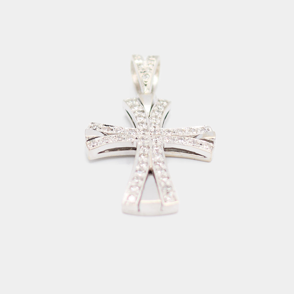 Angled view of a pre-owned 14K white gold diamond cross pendant showing the depth of the flared arms and beveled edges.