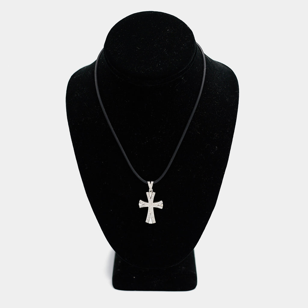 Pre-owned 14K white gold diamond cross pendant, shown on a black cord necklace against a display bust. Pendant measures 1 1/4 inch.
