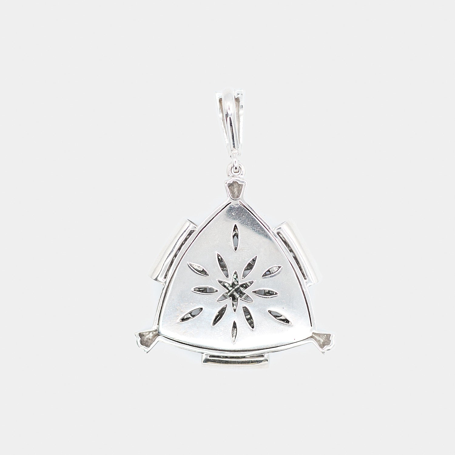 Back view of a pre-owned 14K white gold Freemason diamond pendant showing the solid reverse side with a decorative cutout starburst and marquise pattern design.