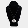 Pre-owned 14K white gold Freemason pendant with diamonds, shown on a black cord necklace against a display bust. The triangular pendant features baguette-cut diamonds and a center cluster of round diamonds. Pendant measures 2.5 inches.