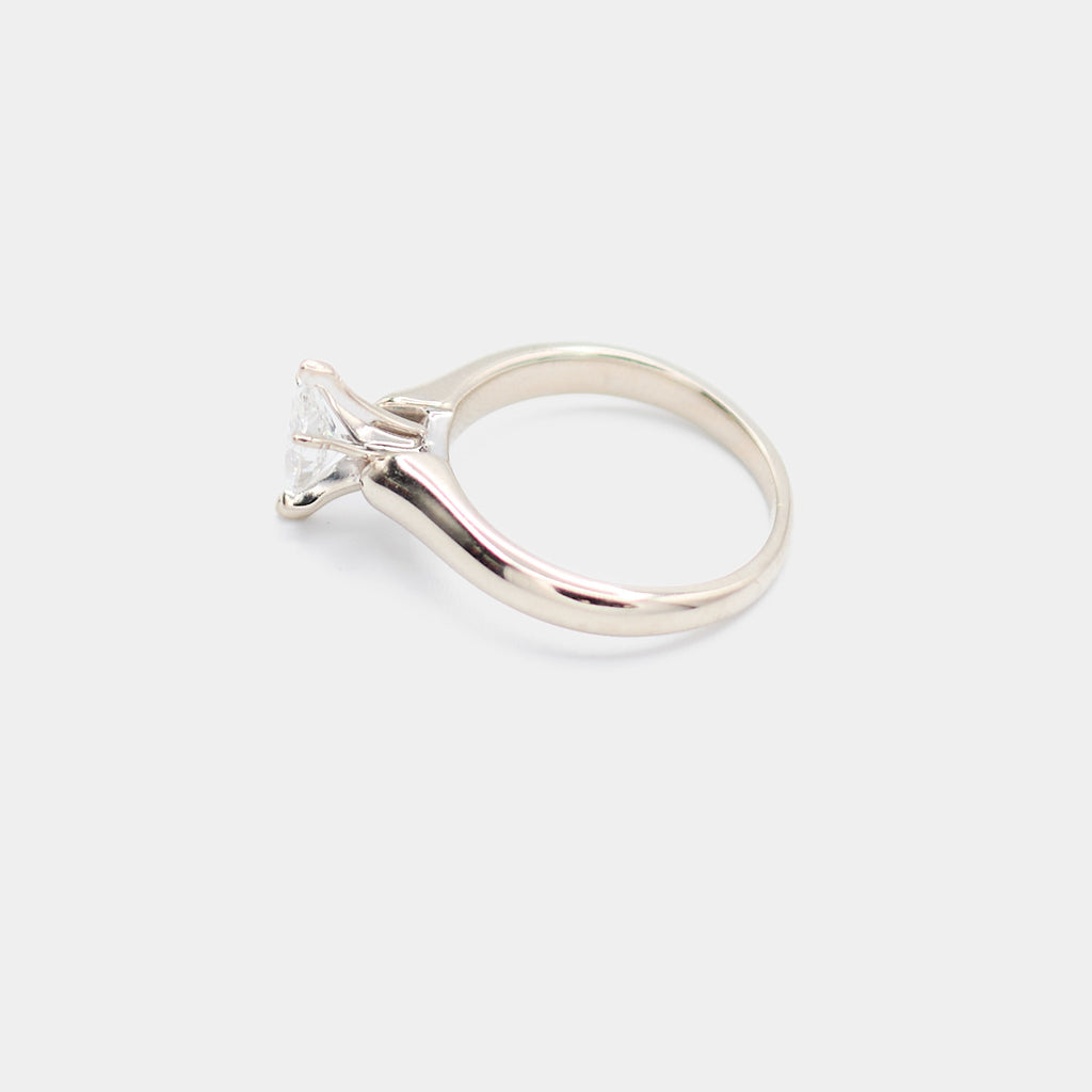 Side profile of a pre-owned 14K white gold engagement ring showing the polished band and marquise diamond setting.