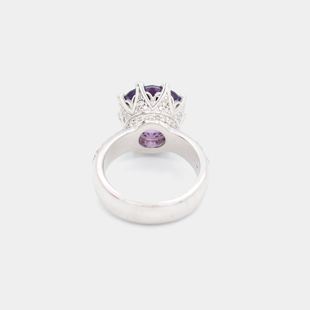 Back view of a pre-owned 14K white gold ring showing the open gallery beneath the purple center stone and diamond chip pave setting wrapping around the band. Size 7.25.