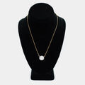 Pre-owned 18K yellow gold box chain necklace with a white gold diamond pendant, featuring round and tapered baguette diamonds in a circular halo design, shown on a display bust. 18 inch chain.