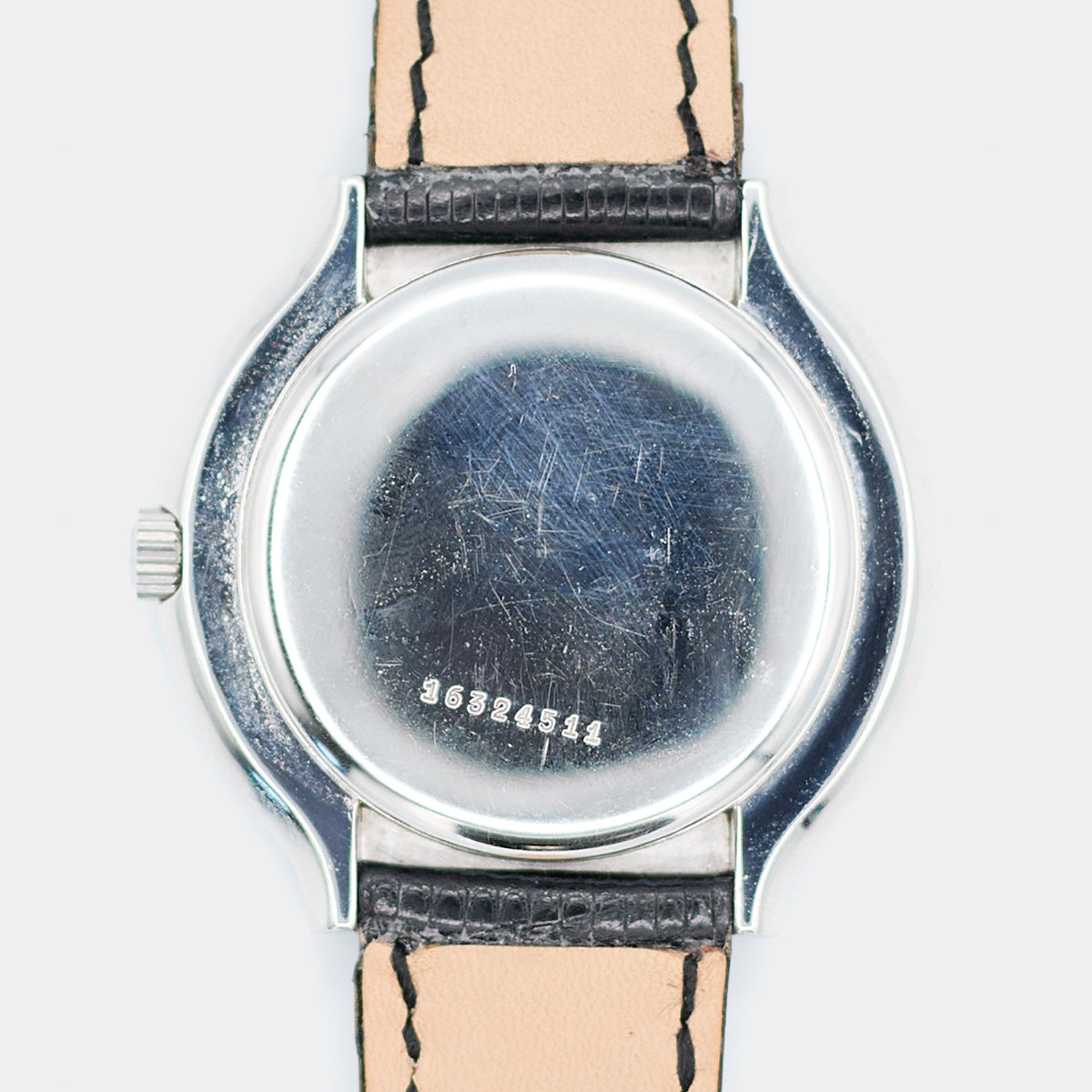 Close-up of the case back on a pre-owned Longines Flagship HF watch showing the stamped serial number 16324511.