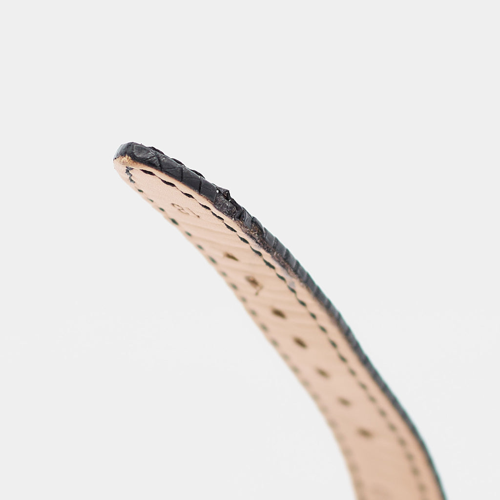 Close-up of the strap tip on a pre-owned Longines Flagship HF watch showing visible wear consistent with age and use.