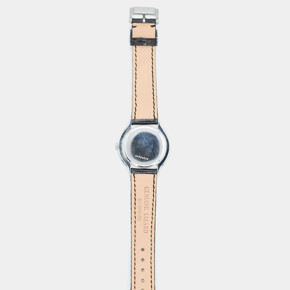 Full length back view of a pre-owned Longines Flagship HF watch laid flat, showing the case back and strap.