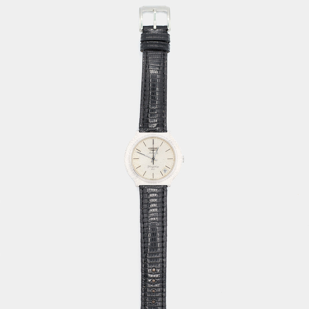 Full length front view of a pre-owned Longines Flagship HF watch laid flat, showing the complete case, dial, and lizard leather strap.