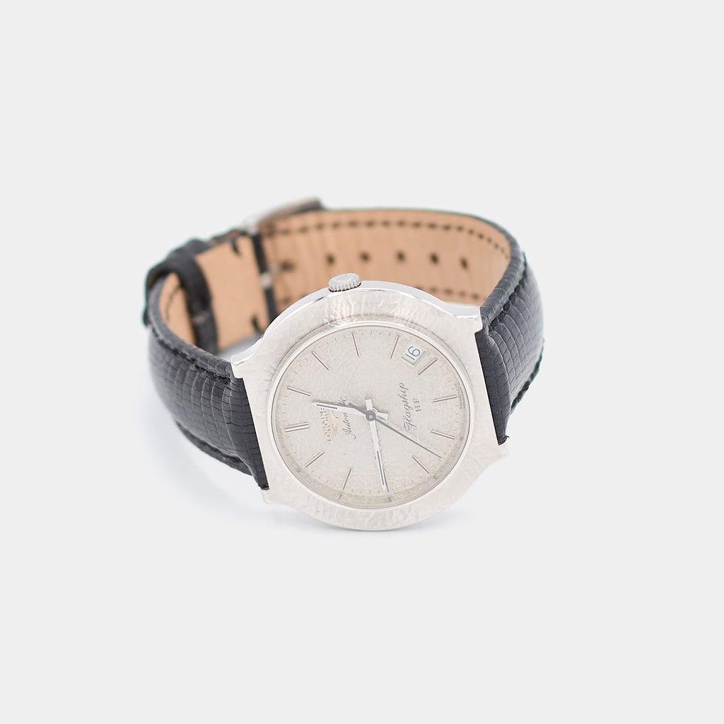 Angled view of a pre-owned Longines Flagship HF watch showing the hammered white gold bezel and crown detail.
