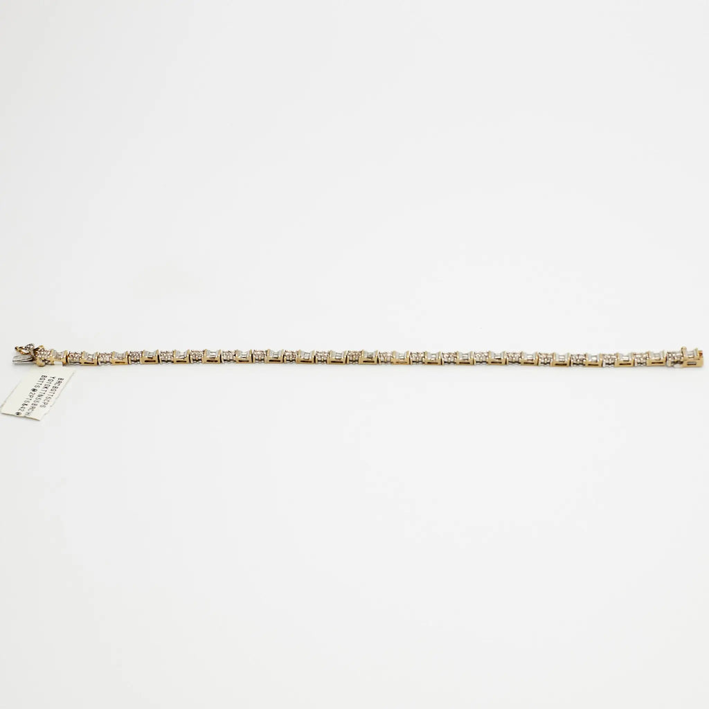 Close-up view of the 10K Dual Tone diamond tennis bracelet, laid flat, emphasizing the setting and 7.99 gram weight.
