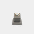 Verified pre-owned 10K yellow gold ring, size 10.25, featuring a brilliant .07 carat round cut diamond on a grey display stand.