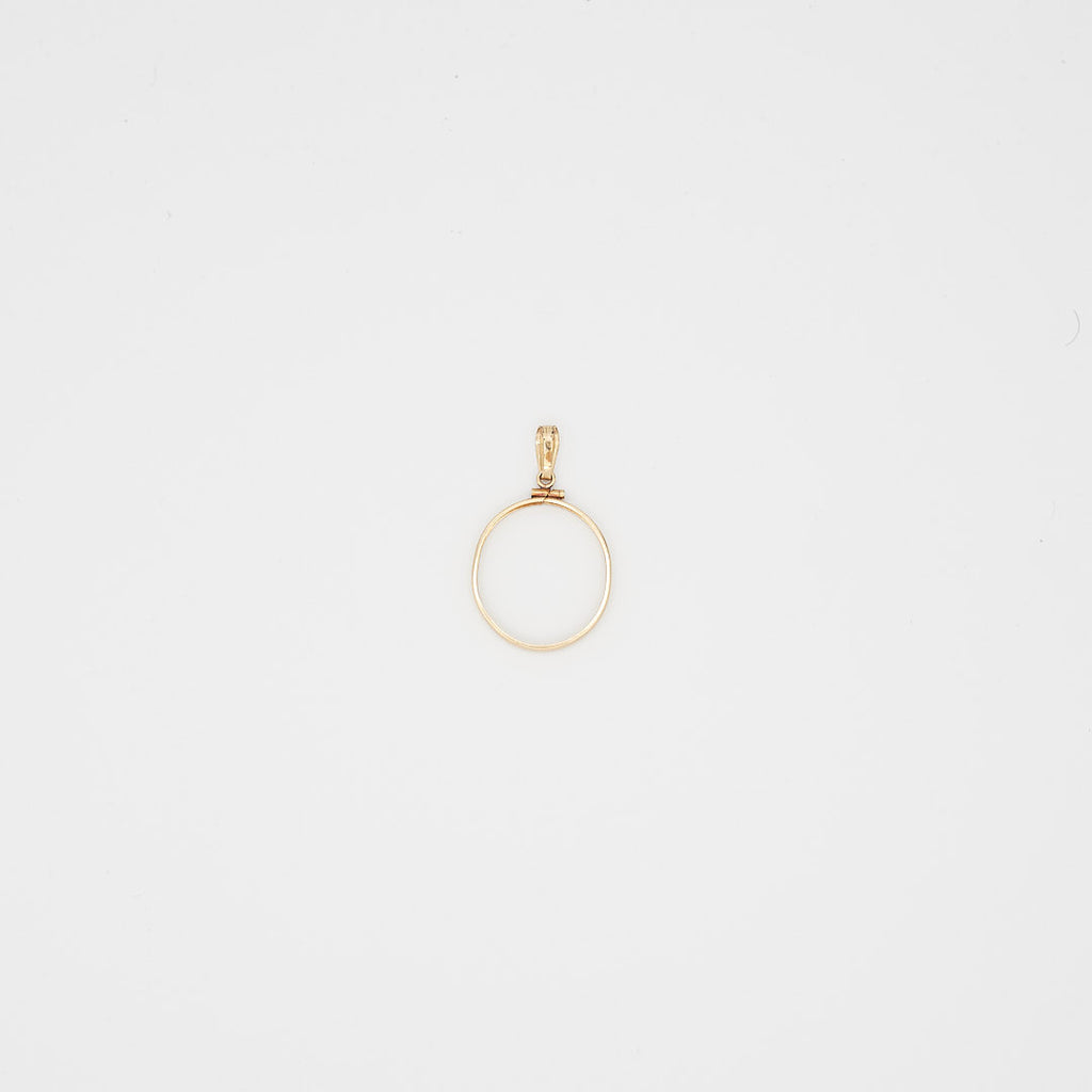 Back view of the 14K gold coin bezel pendant, highlighting the secure mounting and 14K gold purity hallmarks.