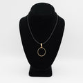 Verified pre-owned 14K gold coin bezel pendant, 1.625 inches long, featuring the removable screw-off top, displayed on a black mannequin.