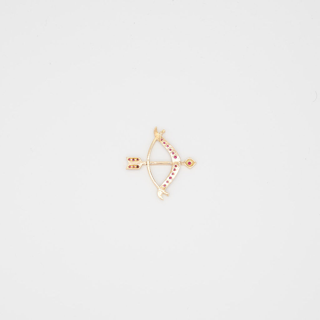 Back view of the 14K gold bow and arrow pendant, highlighting the solid construction, secure setting, and 14K gold purity hallmarks.