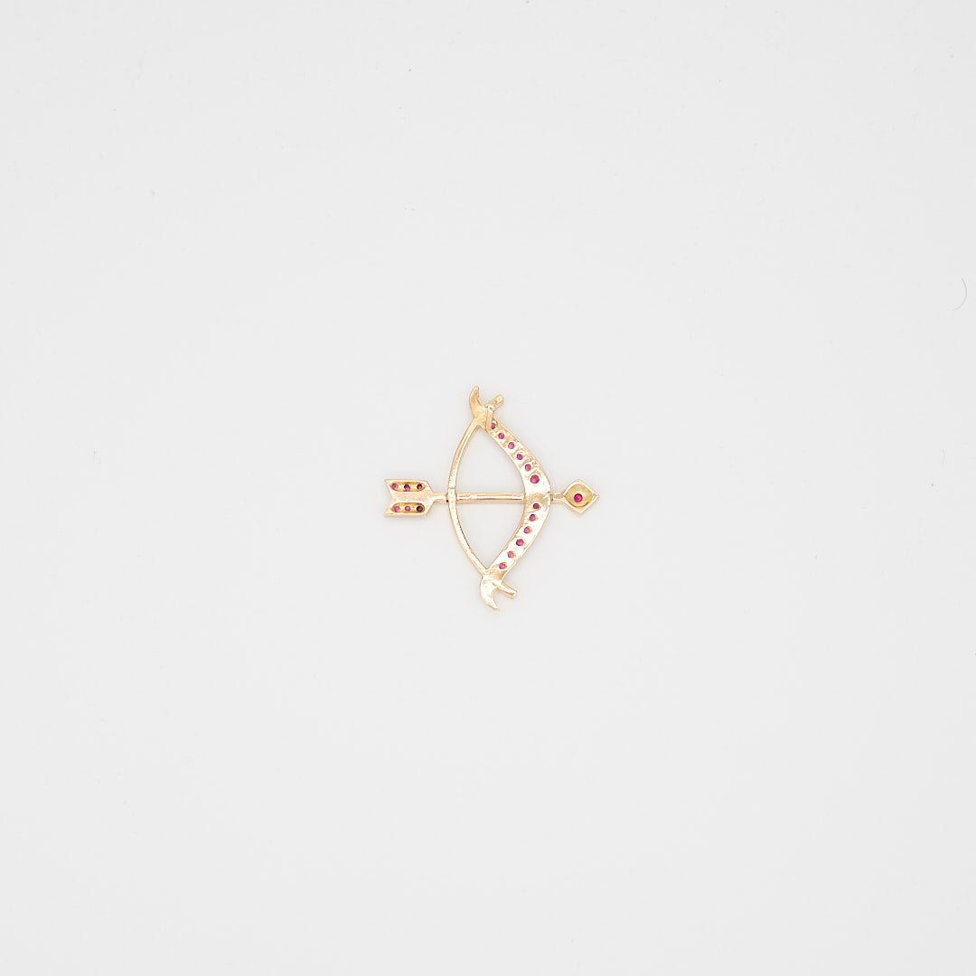 Back view of the 14K gold bow and arrow pendant, highlighting the solid construction, secure setting, and 14K gold purity hallmarks.