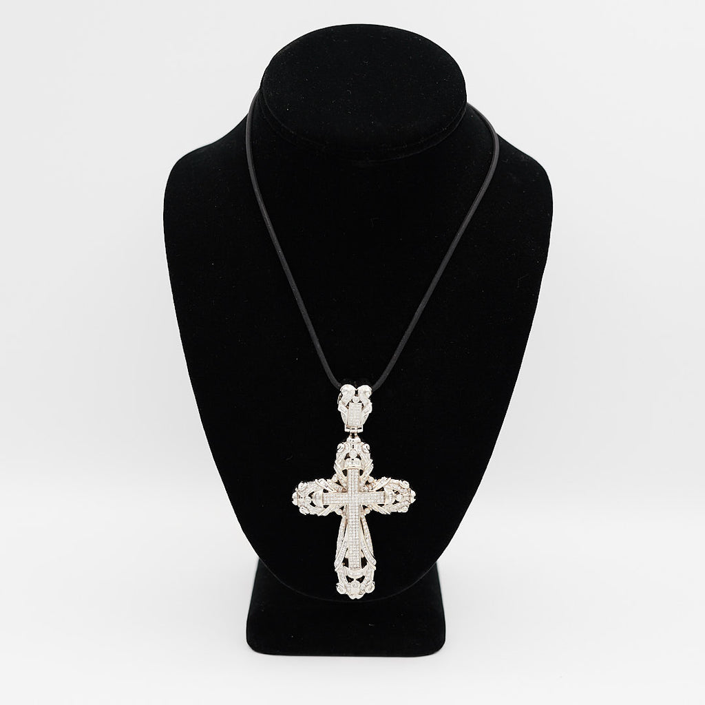 Verified pre-owned 14K white gold large cross pendant, featuring over 3 carats of round and baguette diamonds, displayed on a black mannequin for scale.