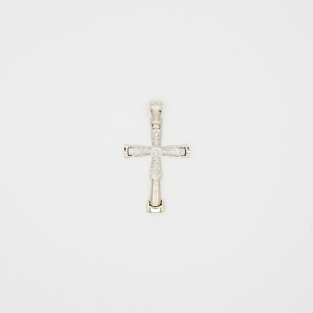 Close-up view of the 14K white gold diamond cross pendant, laid flat, showcasing the round cut diamond placement and 20.65 gram weight.