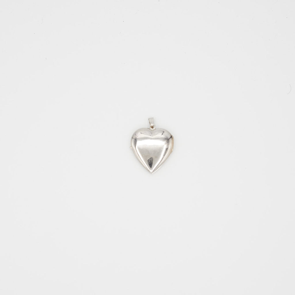 Back view of the 14K white gold heart photo locket pendant, highlighting the hinge, bail, and 14K gold purity hallmarks.