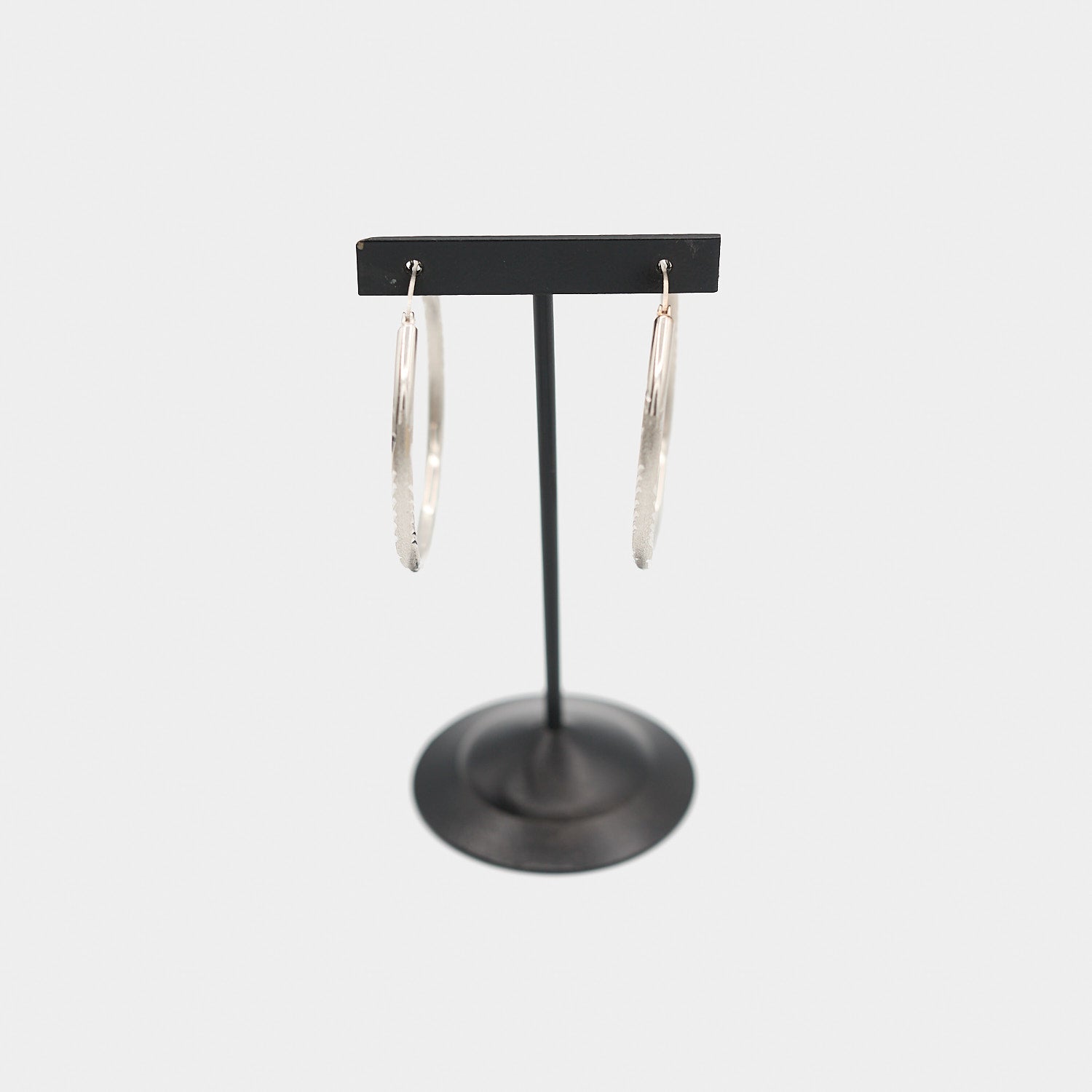 Verified pre-owned 14K white gold hoop earrings, front-facing view showcasing the classic circular design and polished white gold finish.