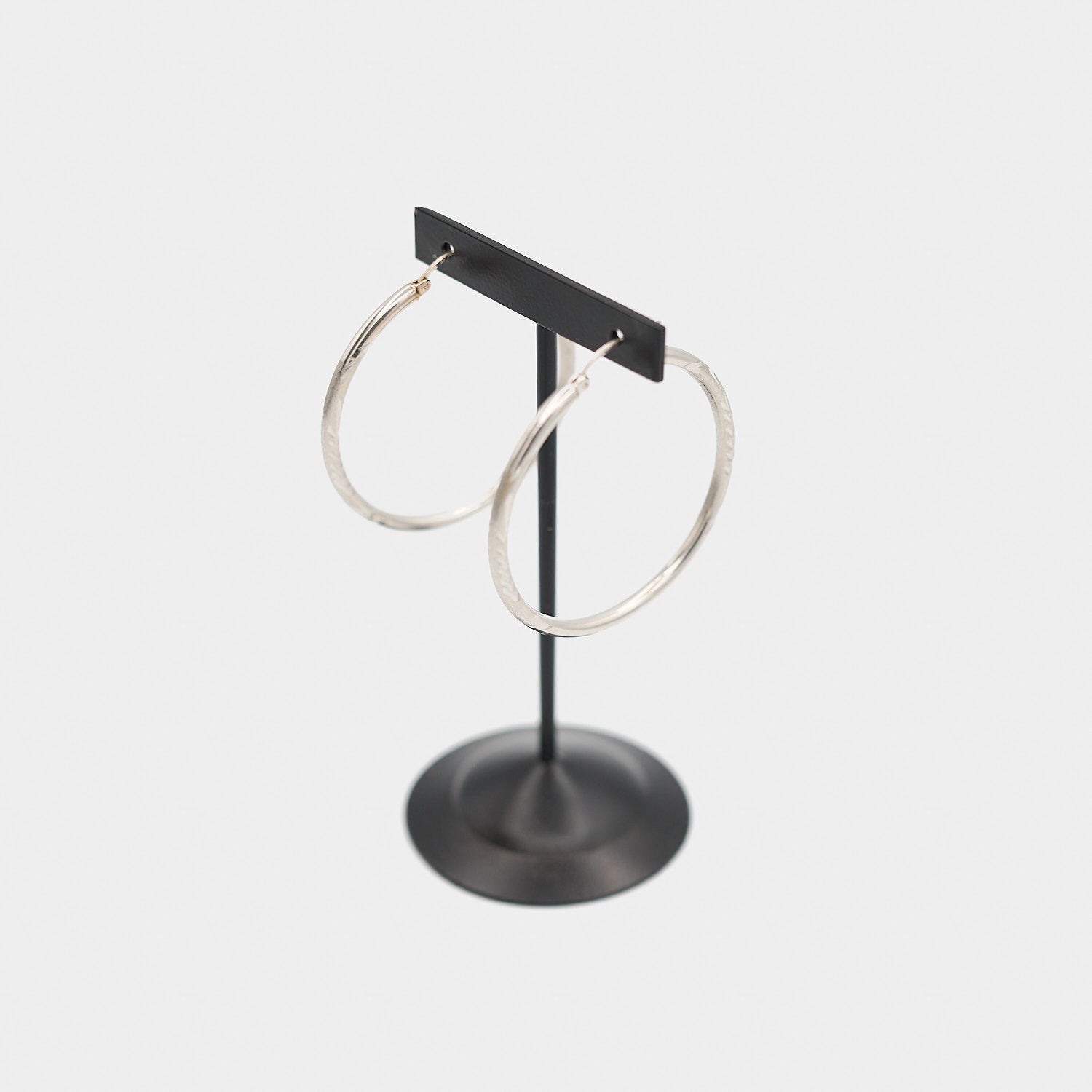 Three-quarter view of the 14K white gold hoop earring set, highlighting the elegant profile and 4.35 gram total weight