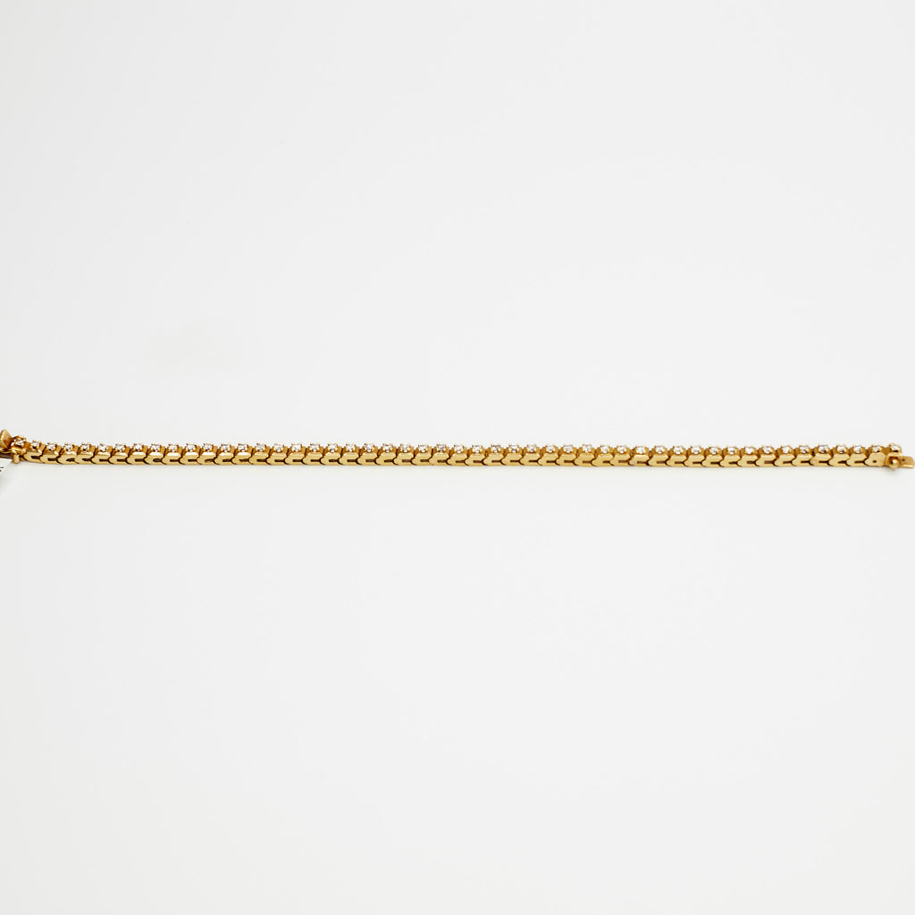 Close-up view of the 18K gold diamond tennis bracelet, laid flat, showcasing the rich 18K gold and 12.86 gram weight.