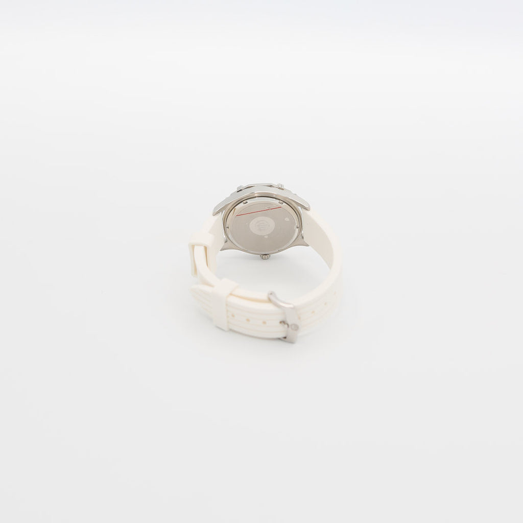 Underside view of the Bulova Marine Star watch, showcasing the case back, serial number, and texture of the white rubber wristband.