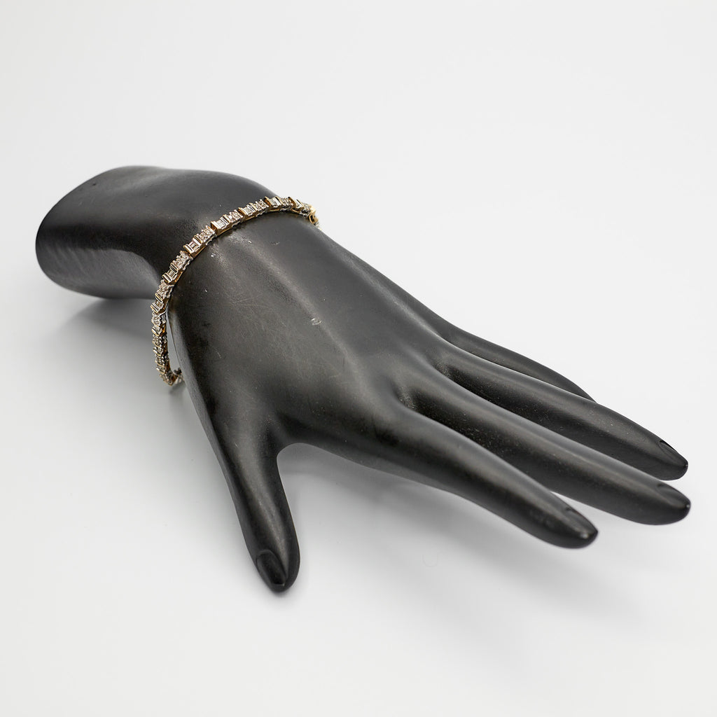 Verified Dual Tone 10K gold diamond tennis bracelet, 7 inches, styled on a mannequin to showcase the two-tone color contrast.