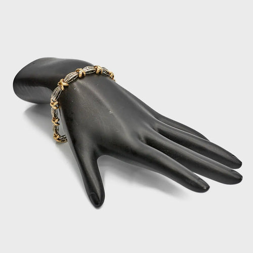 Pre-Owned Dual Tone 10K Gold 'X' Diamond Bracelet, 7.25 inches, styled on a mannequin to show the fit and two-color shine.