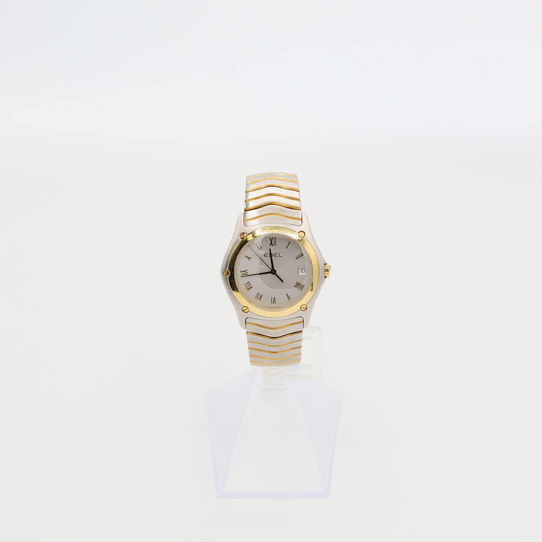Verified pre-owned Ebel Classic Wave E1187F41 men's watch, 38mm case, showcasing 18K gold accents and sapphire crystal glass.