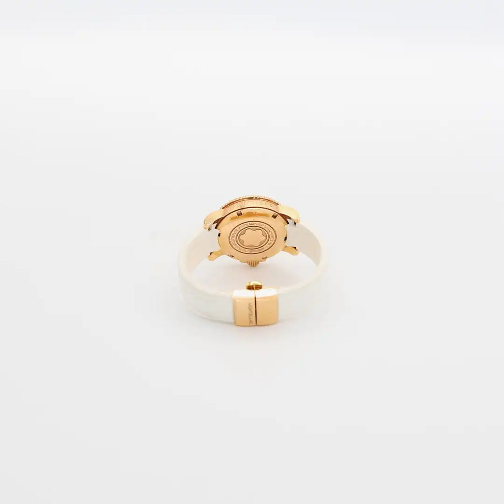 Close-up view of the 18K gold case back on the verified Montblanc diamond watch, showing purity hallmarks and serial number.