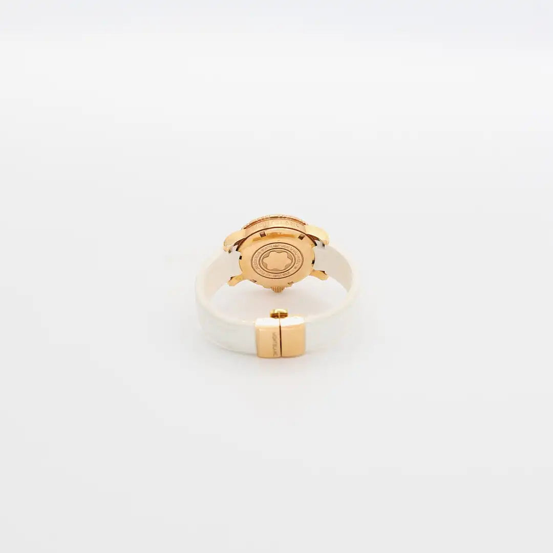 Close-up view of the 18K gold case back on the verified Montblanc diamond watch, showing purity hallmarks and serial number.