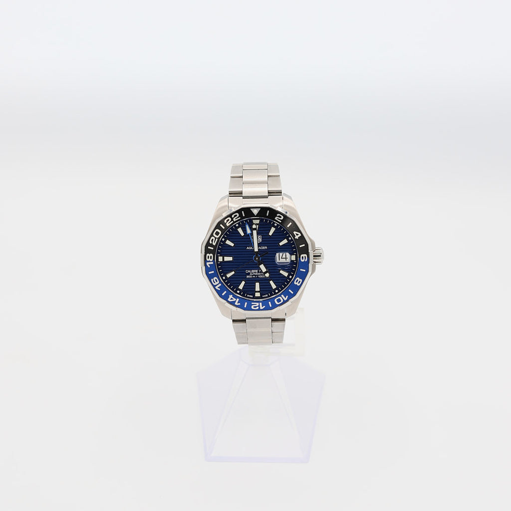Verified pre-owned TAG Heuer Aquaracer 43mm automatic watch, showcasing the dial and glow-in-the-dark hour markers.