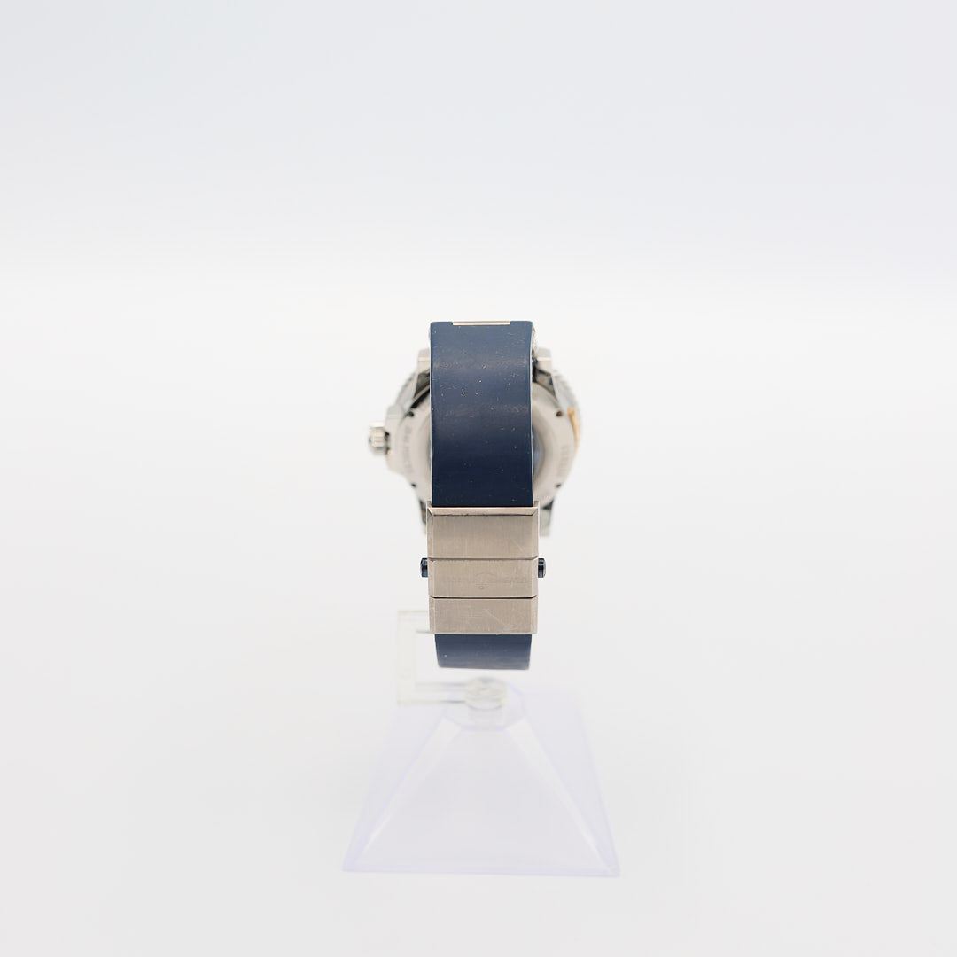 Back view of the Ulysse Nardin Marine Diver watch, showcasing the navy blue rubber band and the deployment clasp mechanism.